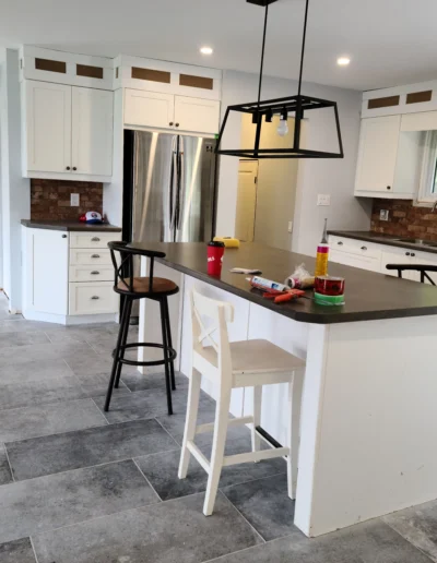 kitchen remodel with new flooring and cabinetry modifications almost completed