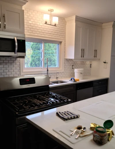 kitchen renovation with quartz countertops and subway tile backsplash